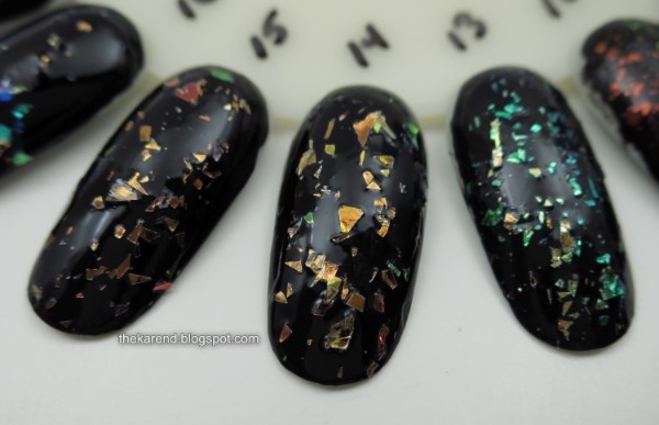 nail wheel with flakie polishes over black