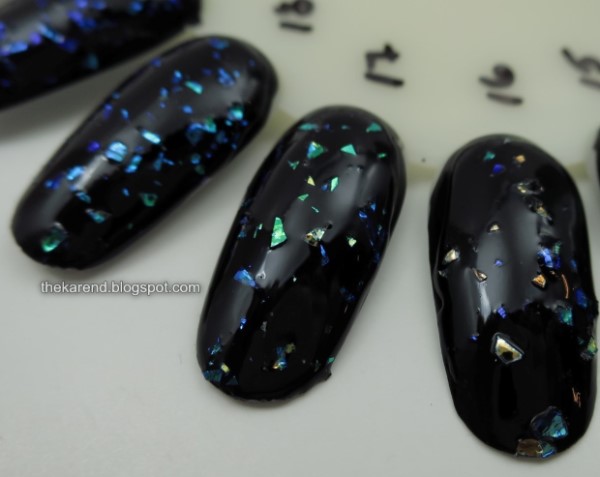 nail wheel with flakie polishes over black