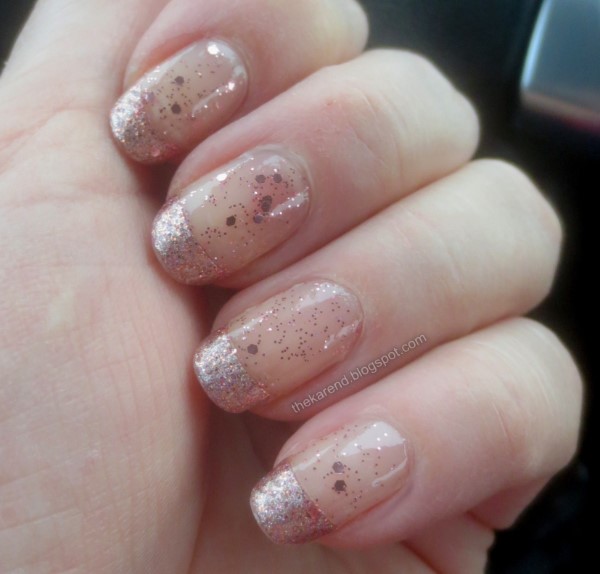 manicure with rose gold microglitter French tips and allover sparse rose gold glitter topper