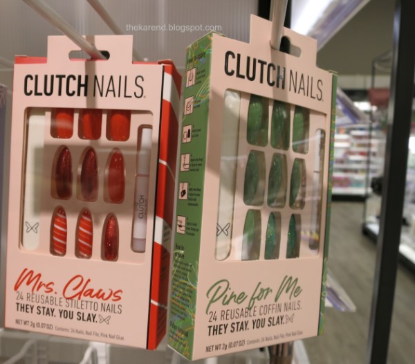 Clutch Nails fake nail sets on display, one red and one green